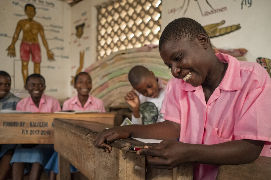 Students sitting in a classroom behind desks.