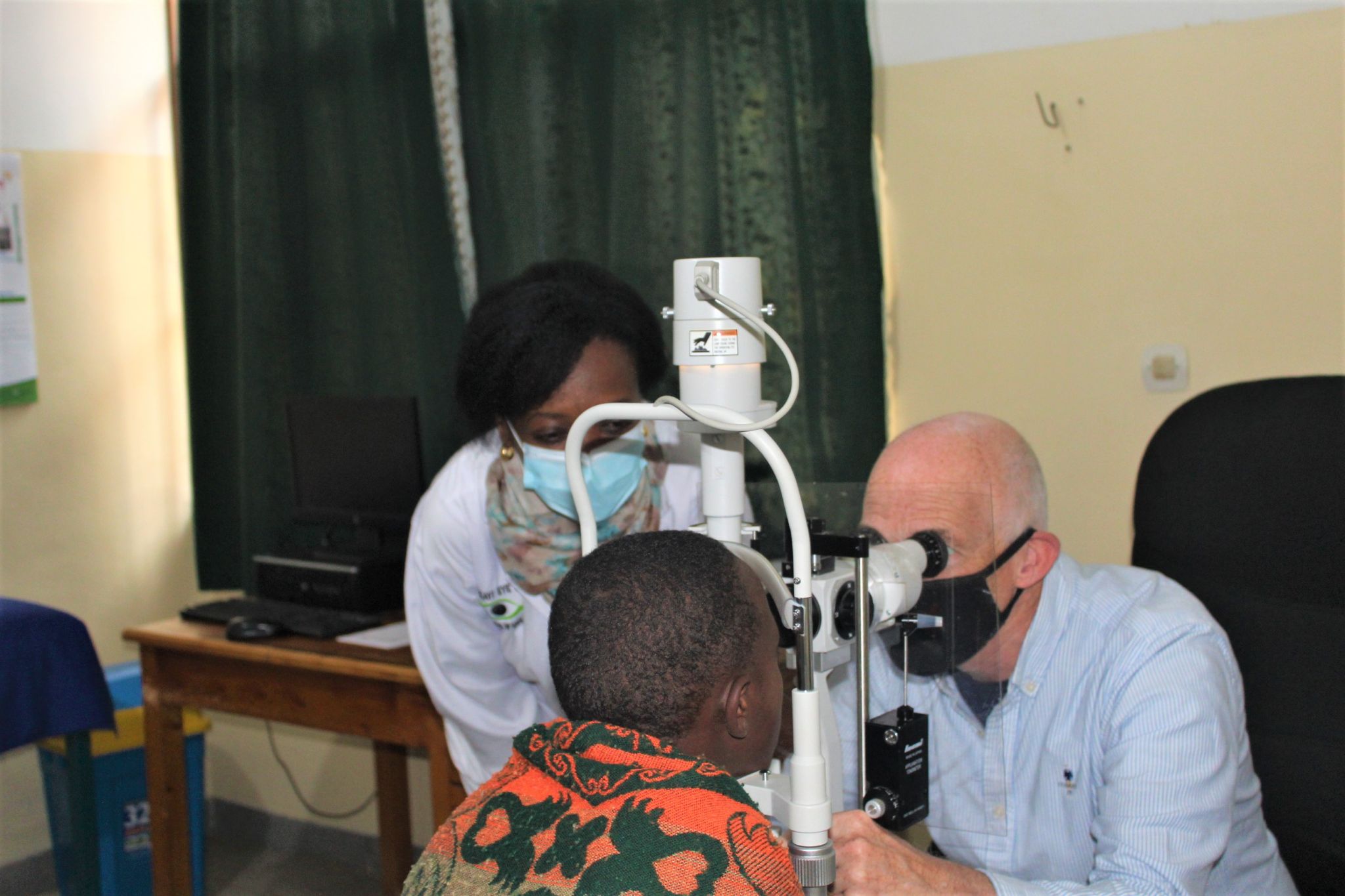 Professor Jonathan Jackson using an ophthalmoscope. 