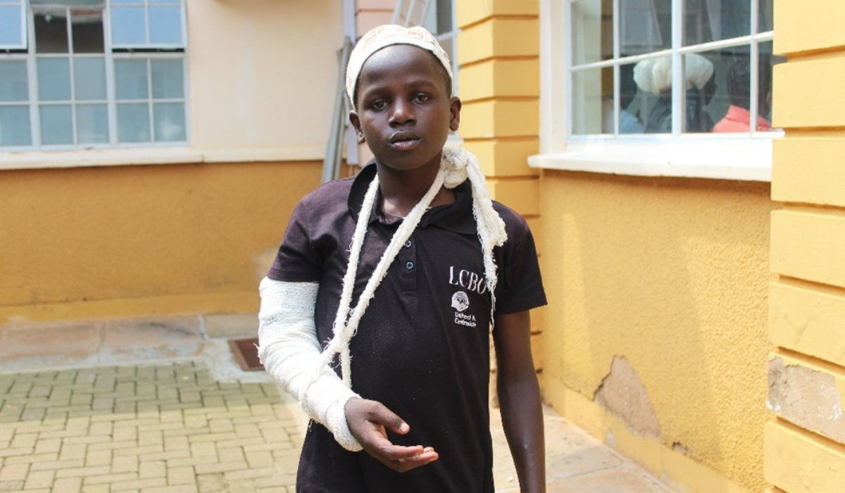 Abdul is wearing a plastercast and using a sling for his arm. 