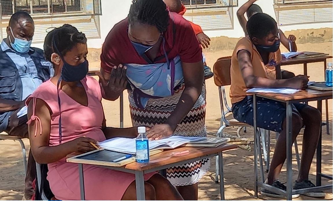 Sibongile being taught at a learning hub outside