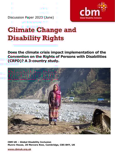 Front cover of Climate Change and Disability Rights, image shows woman standing on empty ground, where her house once stood
