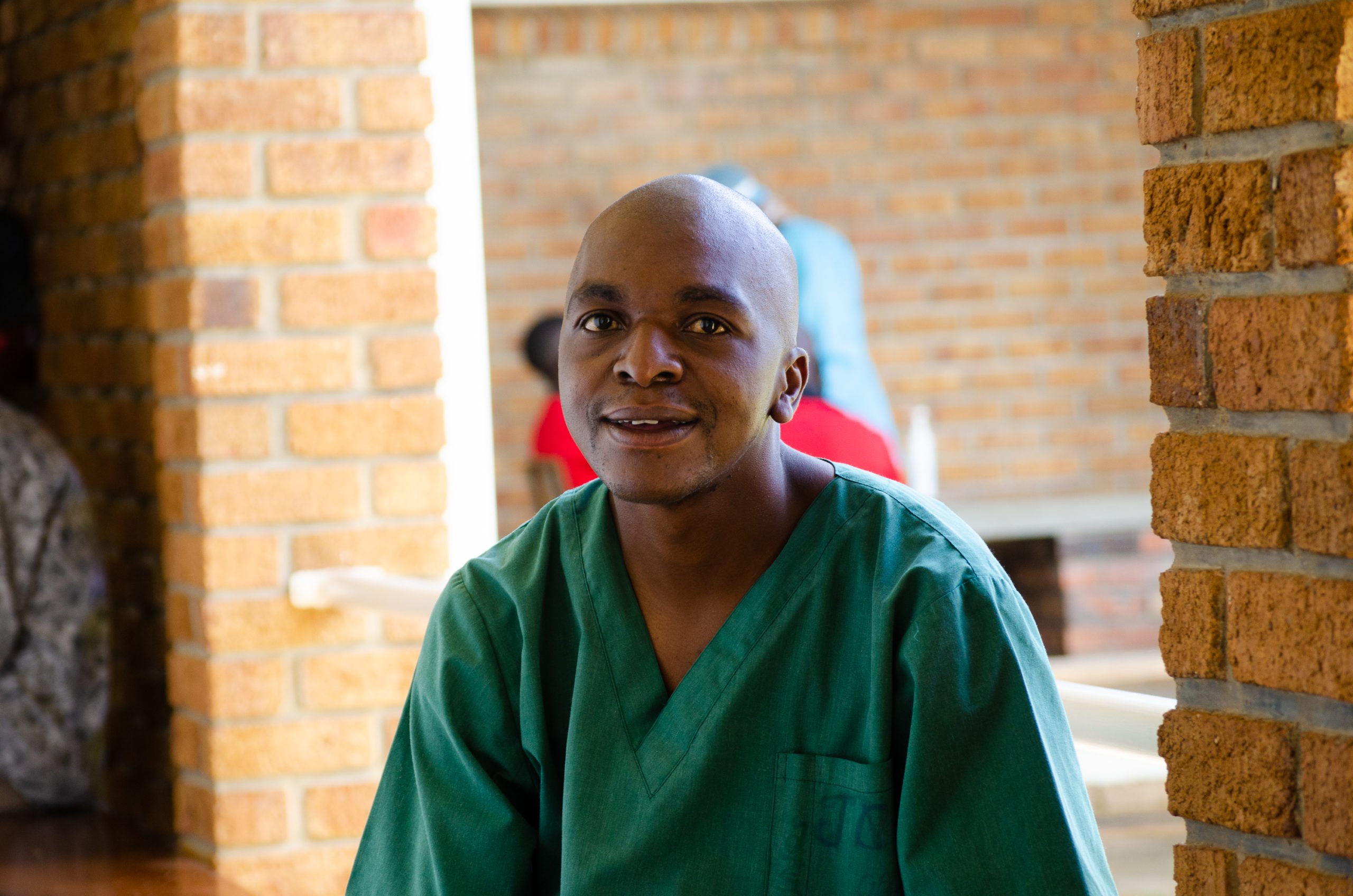 Trynos smiling and wearing his hospital uniform