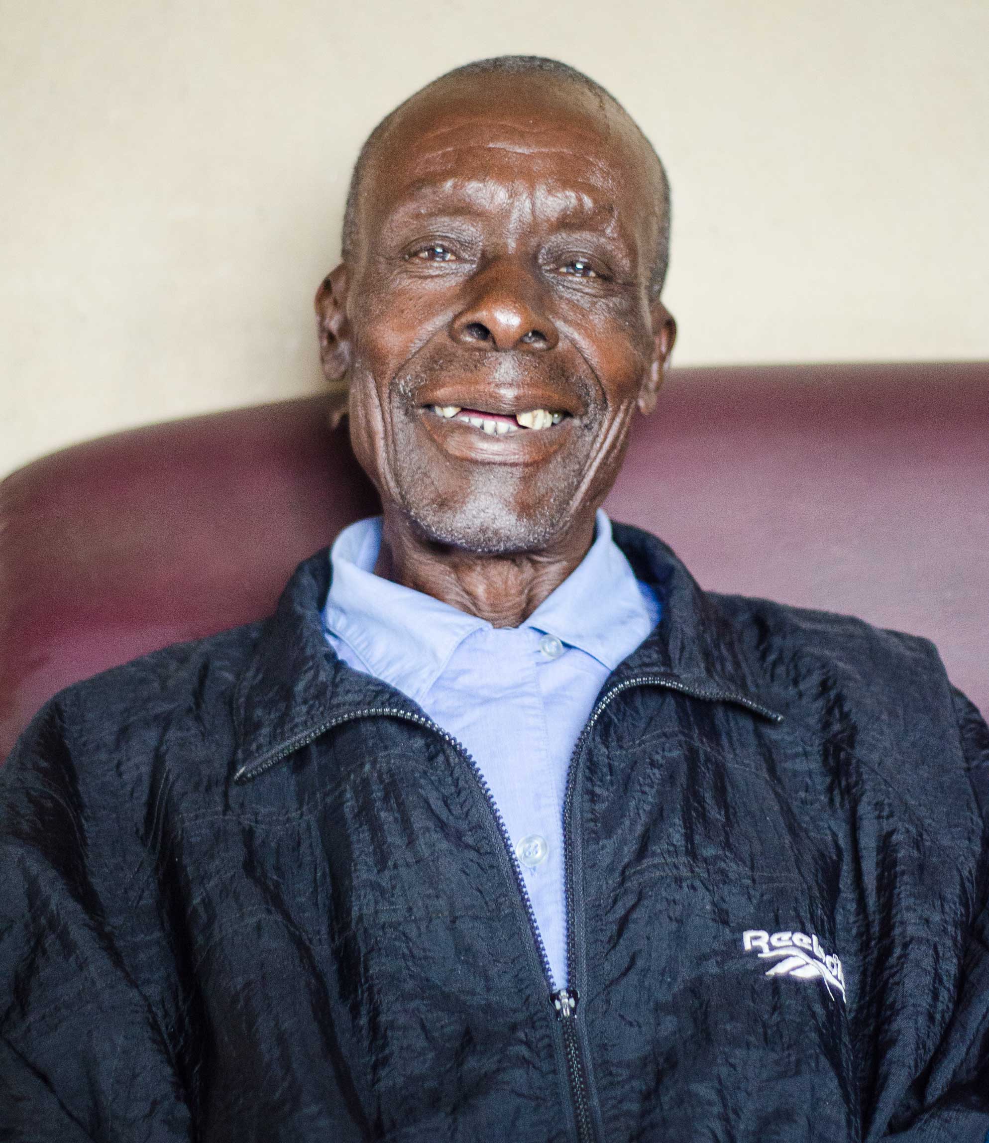 Tera sat inside his home in Zimbabwe, smiling