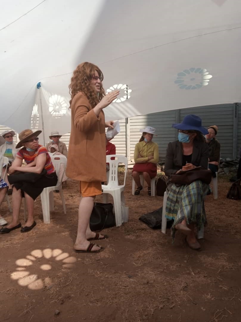 Girl with albinism sharing her experience and giving advice to younger girls, at one of the self-esteem seminars