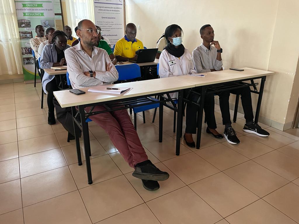 Participants of the training sitting at desks.