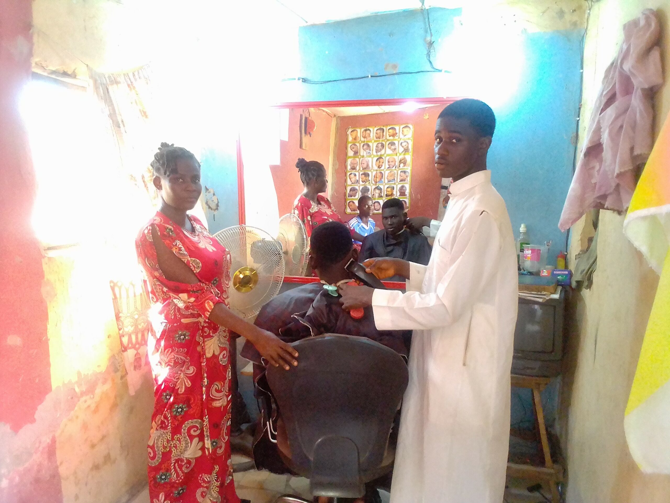Lawal with her son in the newly-opened barber’s salon