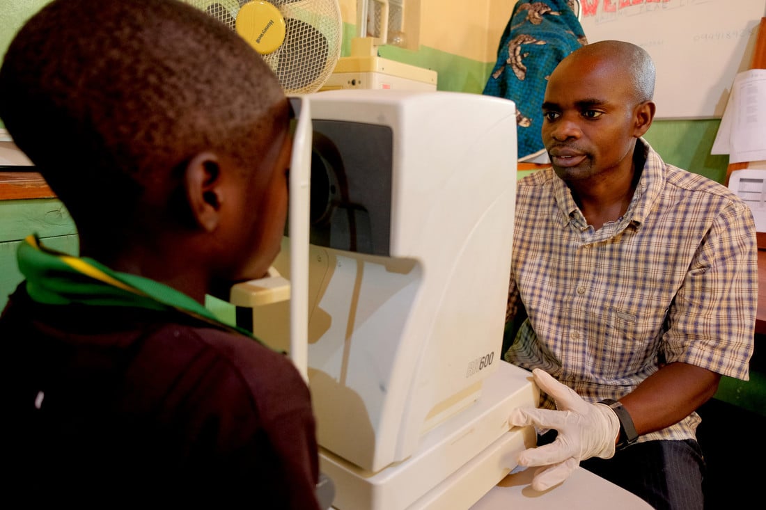 Jabes at Nkhoma hospital, having an eye examination