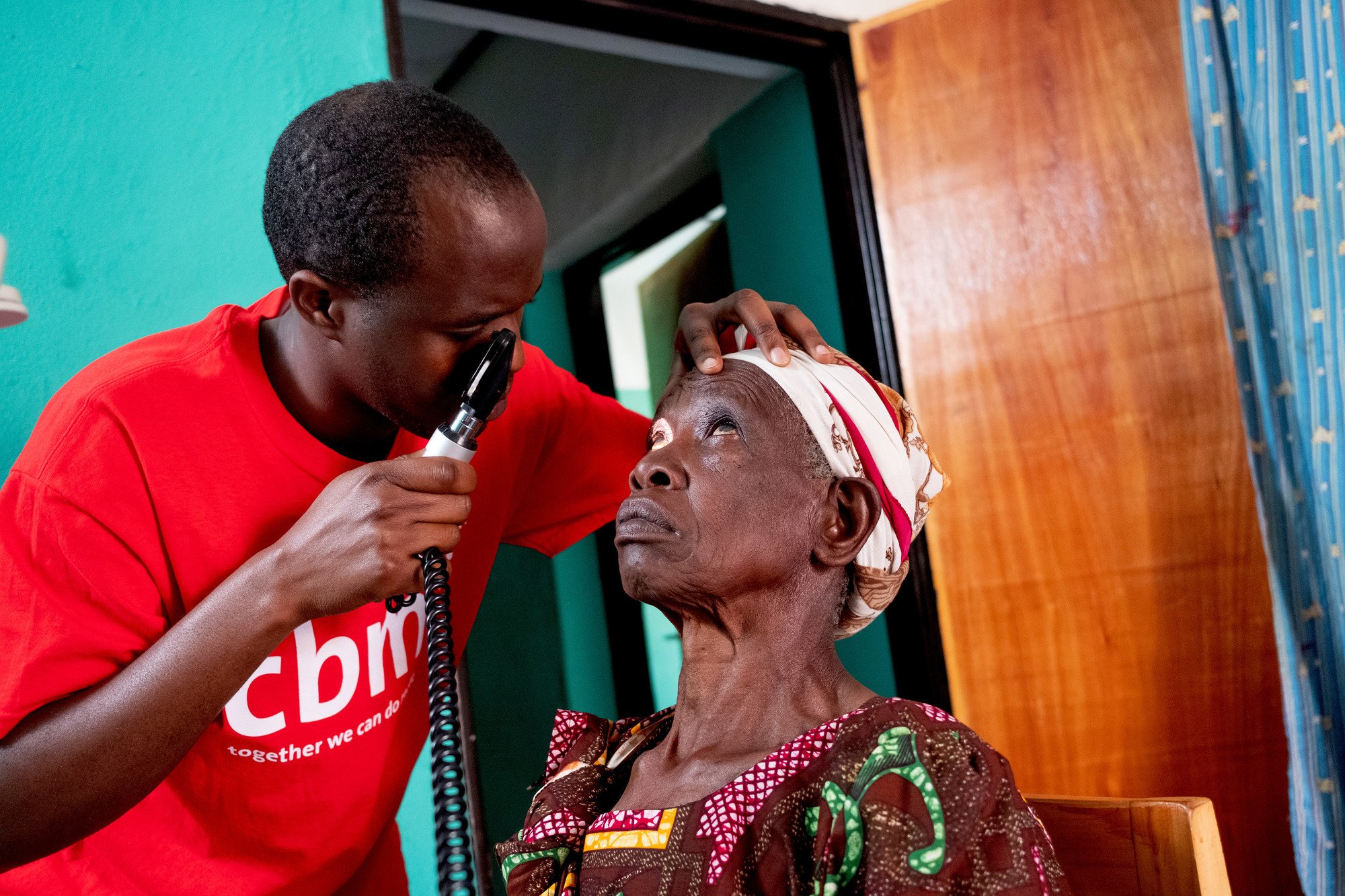 Genesita from Rwanda having an eye exaimination
