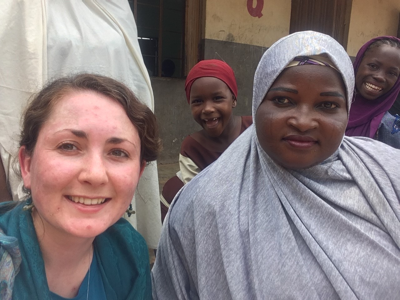 Rebecca and Rabi smiling to camera, together.