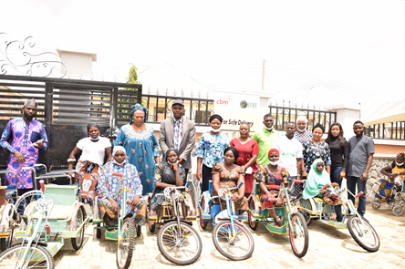 Self-help group members receiving assistive devices at SFHF office