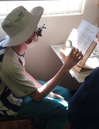 Youth with albinism at Sekuru Kaguvi Hospital, undergoing low vision assessments 