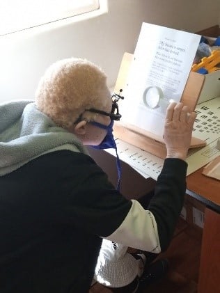 Youth with albinism at Sekuru Kaguvi Hospital, undergoing low vision assessments