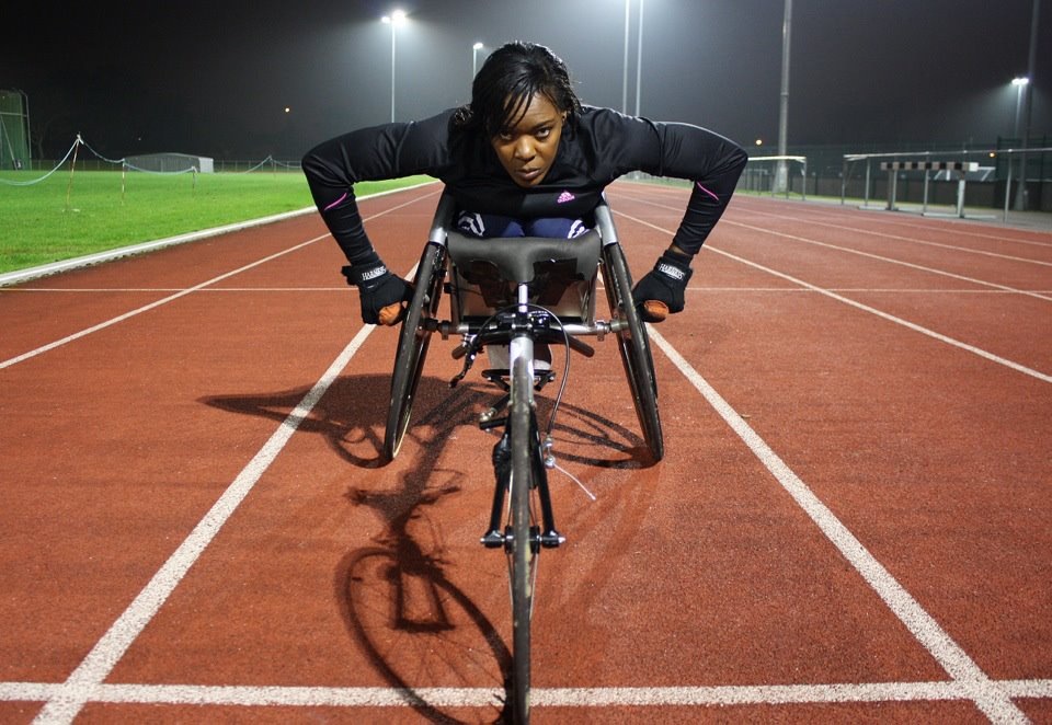 Anne Wafula Strike on her tricycle before a race.