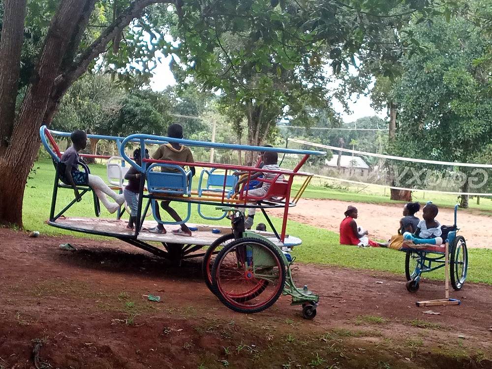 Children at CoRSU Hospital playing with new play equipment.