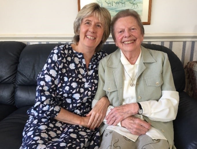 Doris sitting with CBM's Sian Tesni