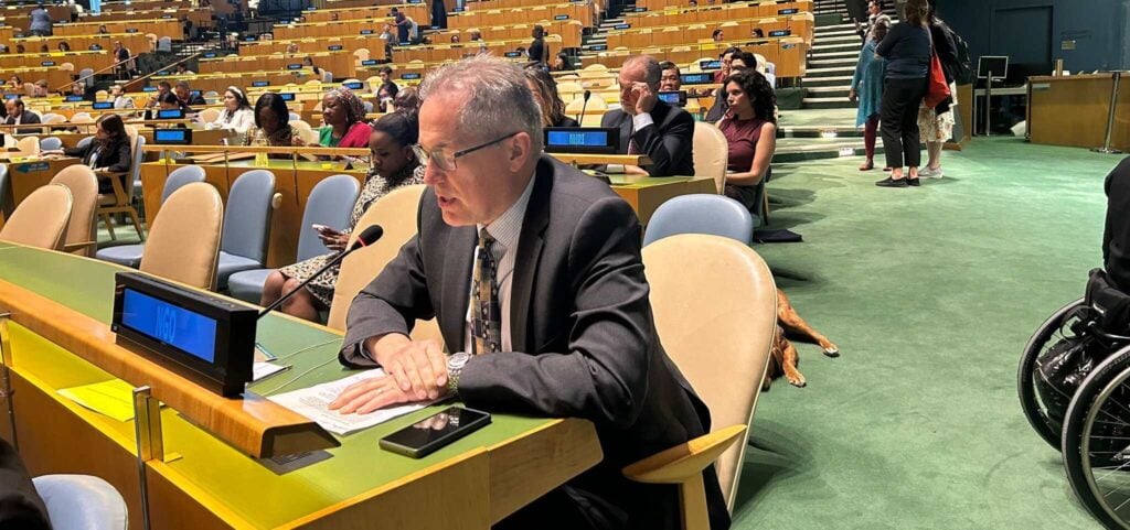 David Bainbridge, seated, gives a statement at the United Nations Headquarters in New York