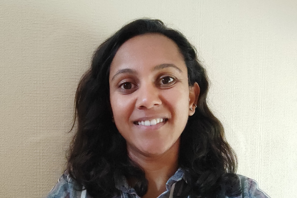 Headshot of Poonam