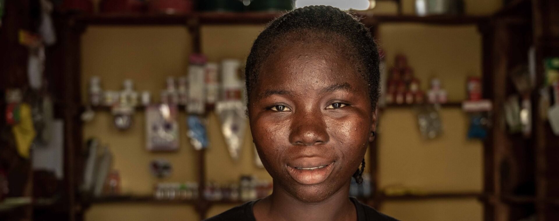 A young woman smiling.