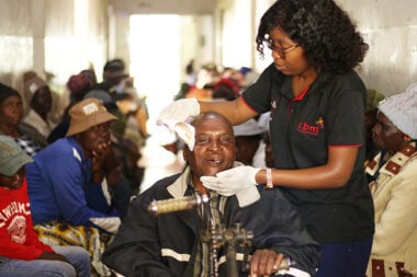 A man having his eye patch removed in Zimbabwe