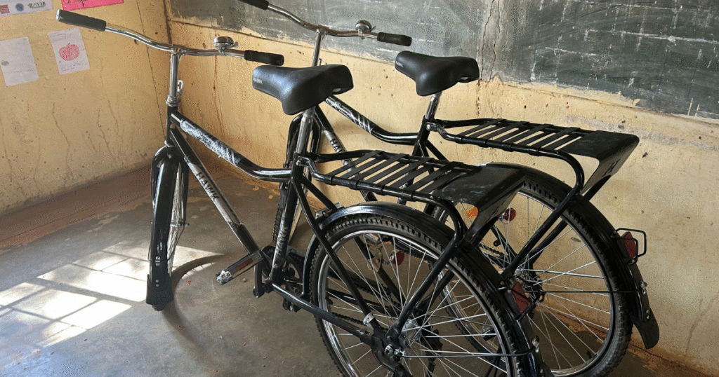 Two bicycles in a school building.