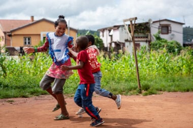 Lucas, runs along with two other children.
