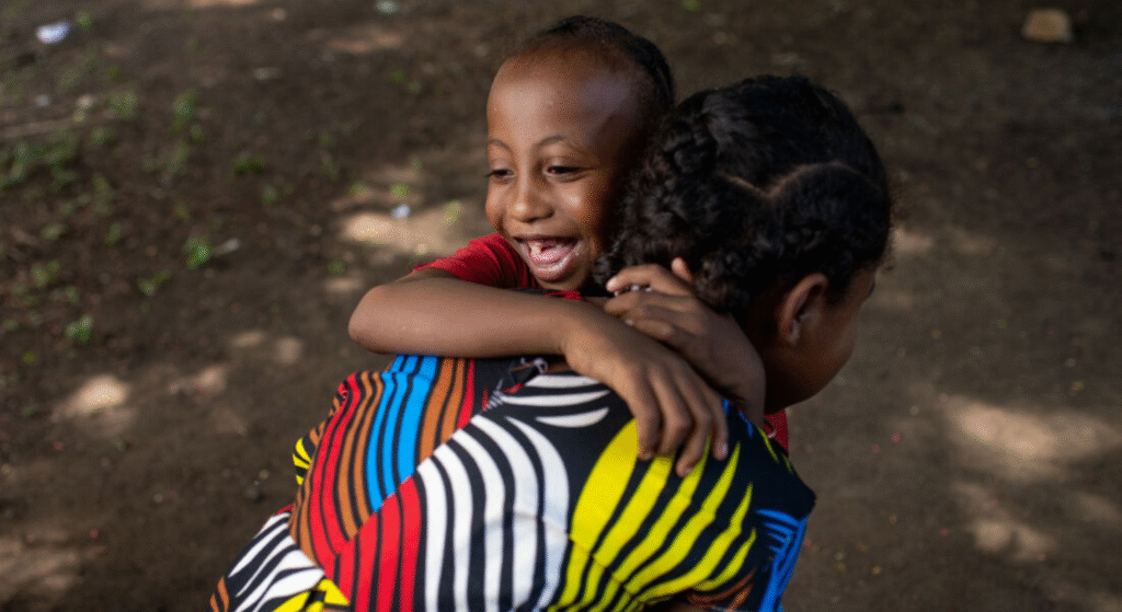A child hugging her mum.