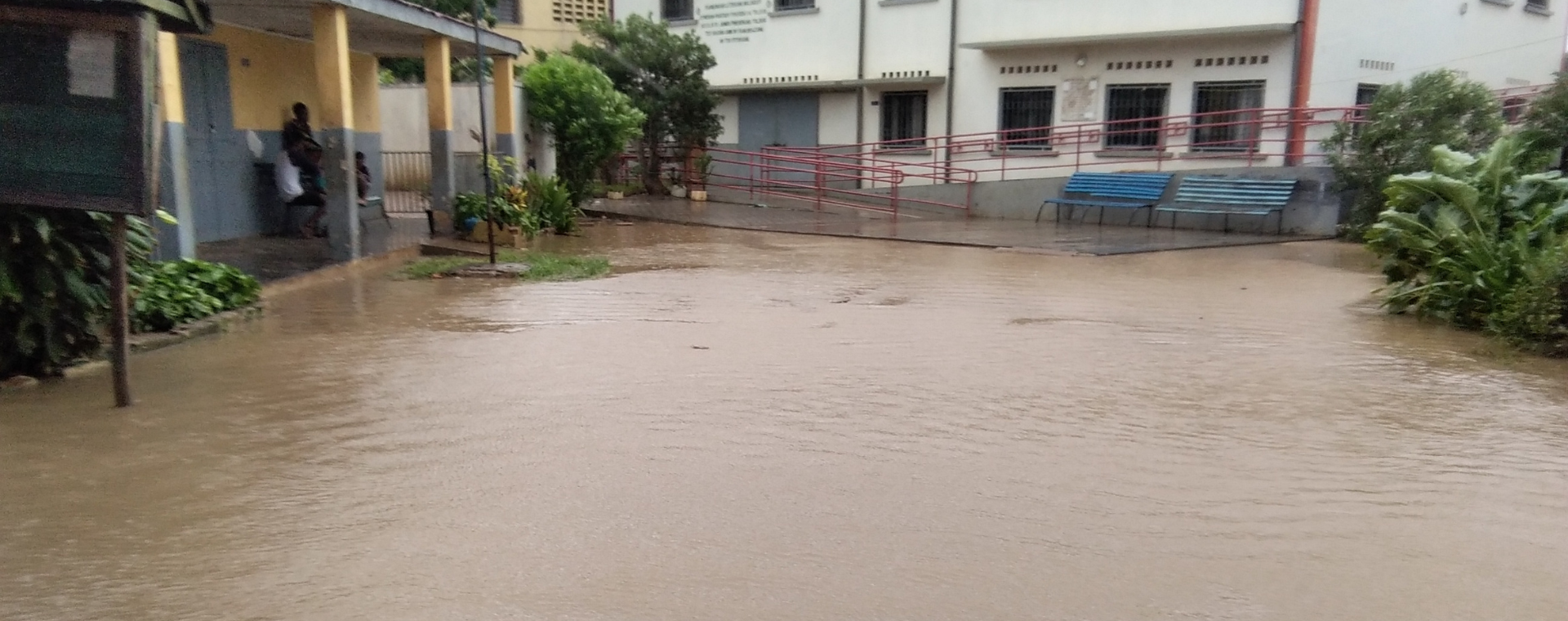 A school flooded with brown floodwater.
