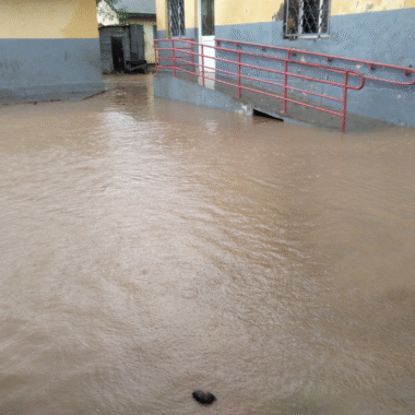 A school flooded with brown floodwater.