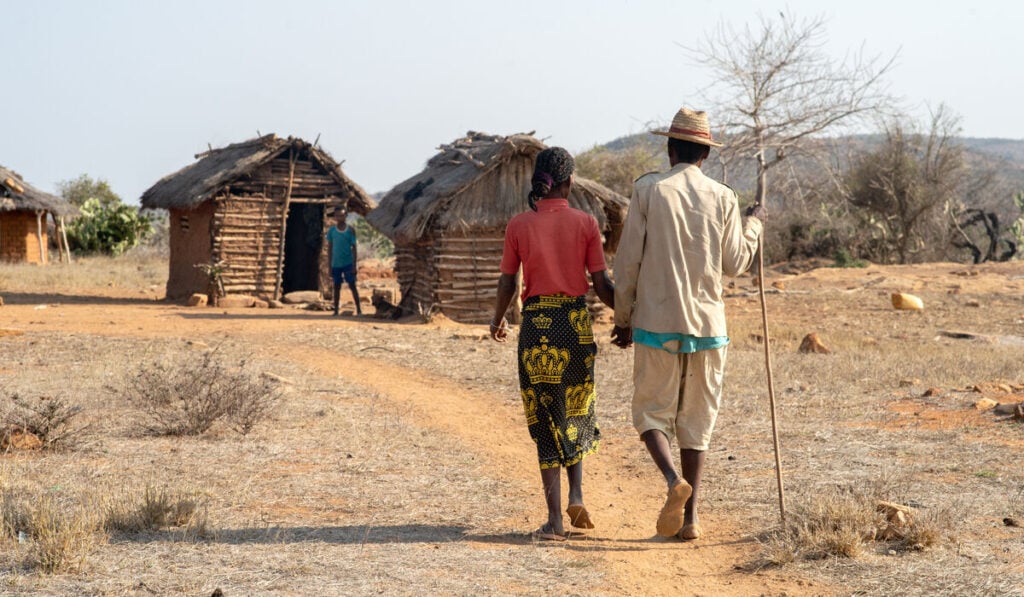 A man and a woman hold hands in the South of Madagascar