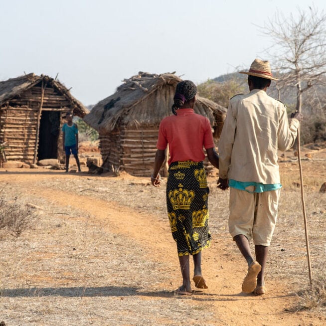 A man and a woman hold hands in the South of Madagascar