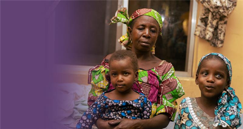 Ikilimi (3) and Mariya (6), sat with their mother Balkisu in Nigeria, West Africa. Both chidlren have cataracts.