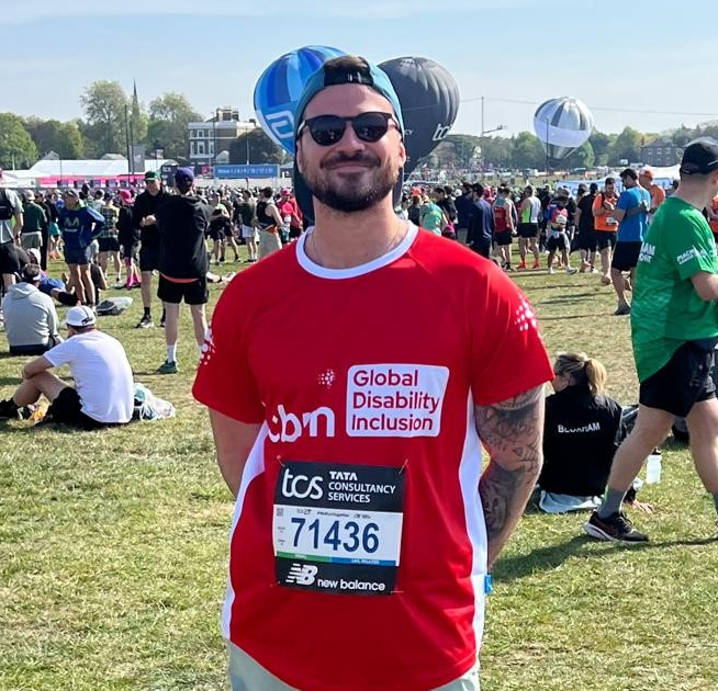 Alex, marathon runner, wearing CBM UK running t-shirt