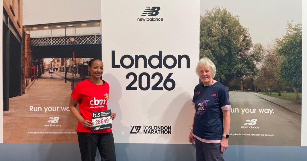 Arwa standing in front of the London Marathon 2026 sign