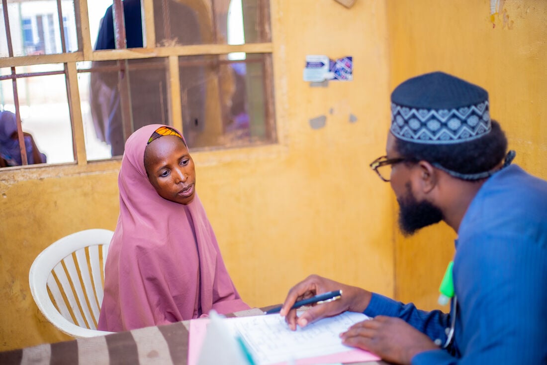 A lady speaking to a member of the medical team at the hospital in Nigeria.
