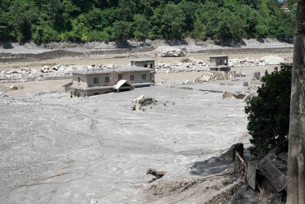 A house surrounded by mud after the flooding in Nepal.